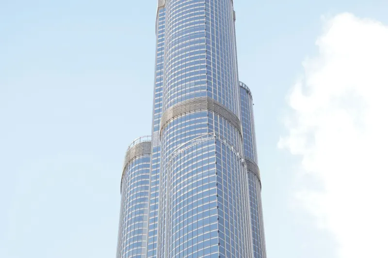 Burj Khalifa tower rising into a blue sky in Downtown Dubai