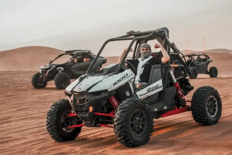 Polaris RZR 1000cc dune buggy and other buggies in the Dubai desert