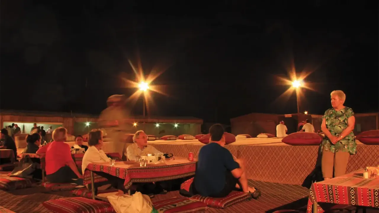 Guests at a Bedouin desert camp in Dubai at night